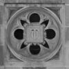 A detail of a decorative stone tile on the exterior of Sullivan Hall on Main Campus. It features the letters T and U.
