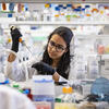 A Temple medical student working with a syringe in a lab