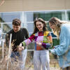 Four Tyler School of Art and Architecture working on cyanotypes outdoors