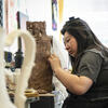 A Tyler School of Art and Architecture student in the ceramics studio working on a piece using clay