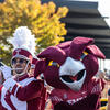 Hooter, Temple University's mascot, posing with a member of the marching band
