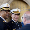 Two police officers greeting someone