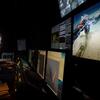 Eric Cordes sitting in his lab, watching images and video of the deep sea as taken by Alvin, the submarine