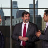 Josh Gladden, Temple’s vice president for research, and Niraj Muni, director of commercialization operations, with an Office of Vice President of Research staff member, in a group and talking among each other