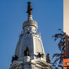 A photo collage comprising pictures of the coliseum in Rome, Italy; Philadelphia City Hall; and a temple in Tokyo, Japan